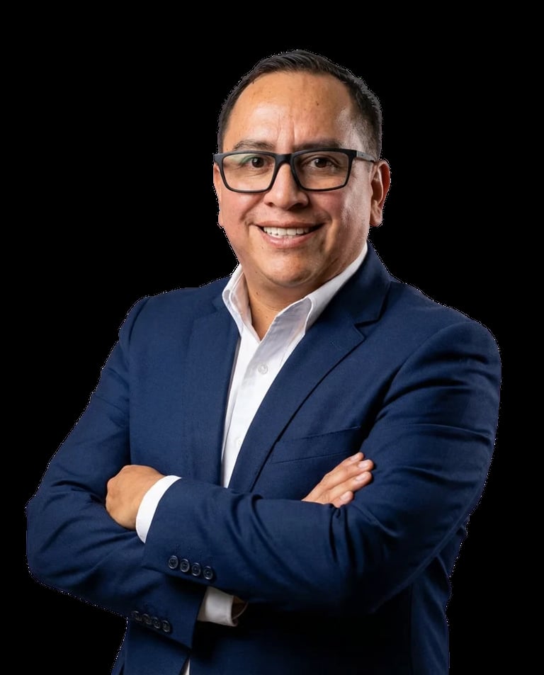 Professional headshot of Francisco Lovely wearing glasses, navy blazer, and white dress shirt